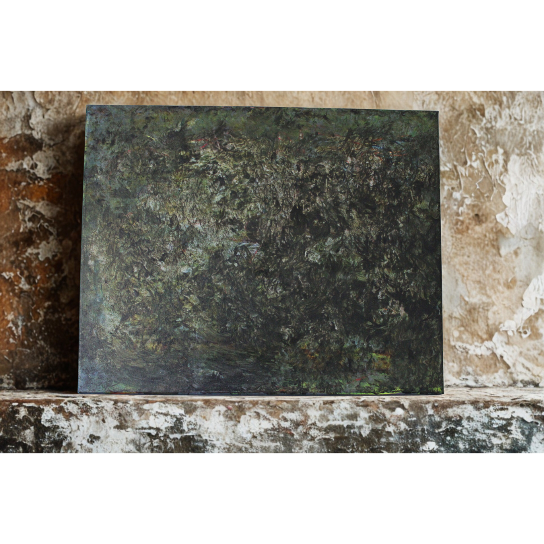 Dark green stone slab on a rustic stone surface