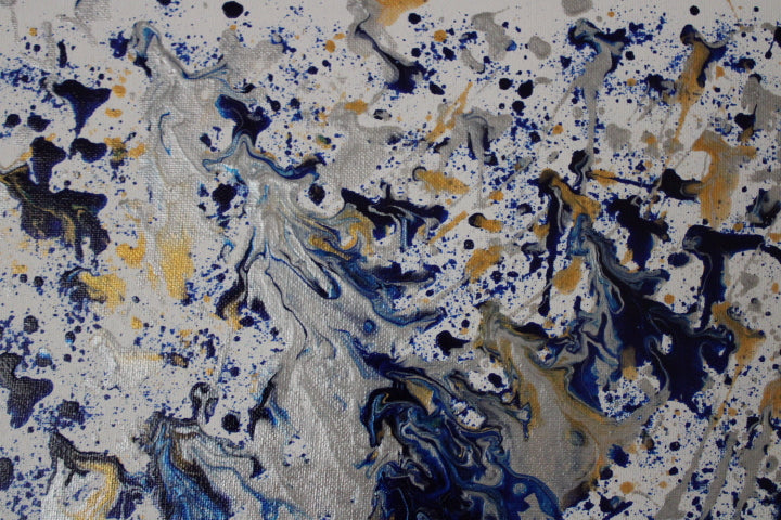 Abstract pattern with blue, yellow, and black splashes on a white background