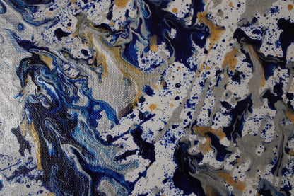 Abstract pattern with blue, gold, and black colors on a textured background